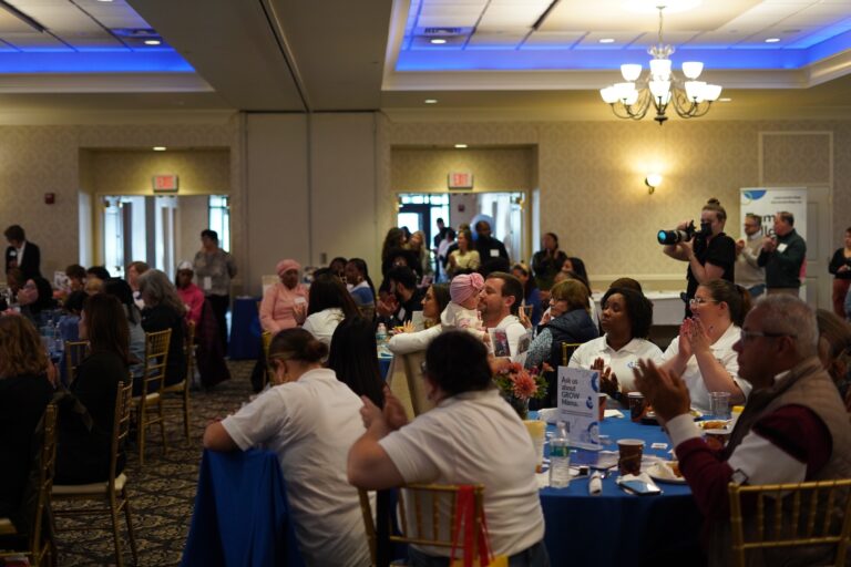 Tables of attendees applaud idea