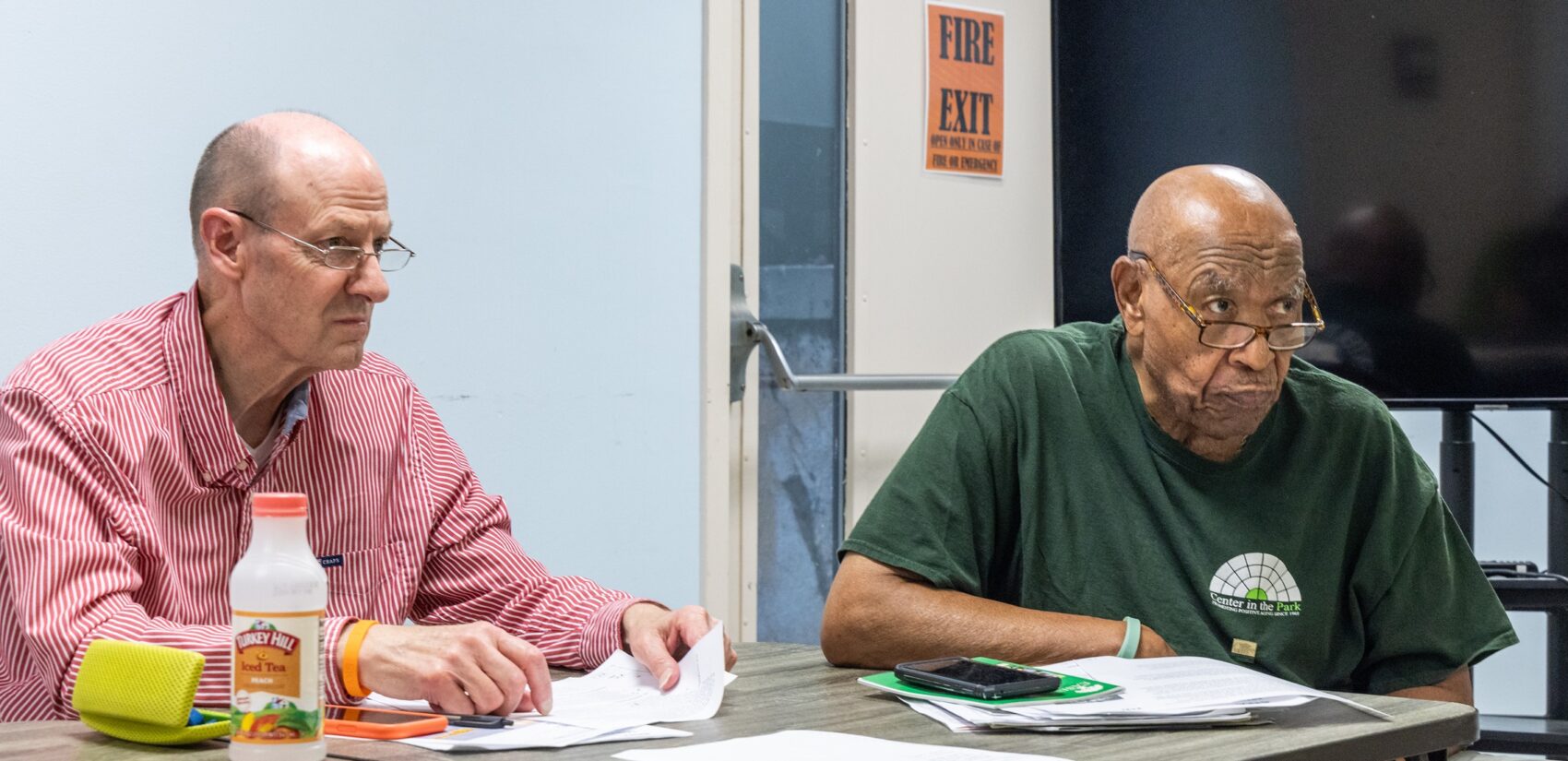 Drew Brown and Fred Lewis sit at a table