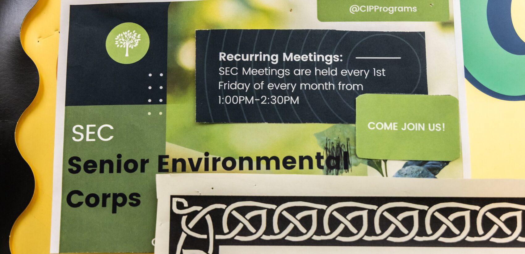 a sign for the Senior Environment Corps says meetings are held every first friday of every month from 1 to 2:30 pm