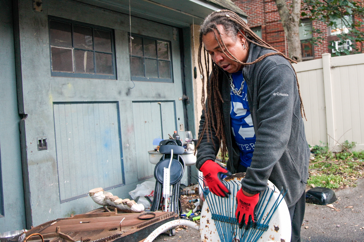 Dendê Macêdo uses a rake to make a kalimba out of a trash-picked metal chair