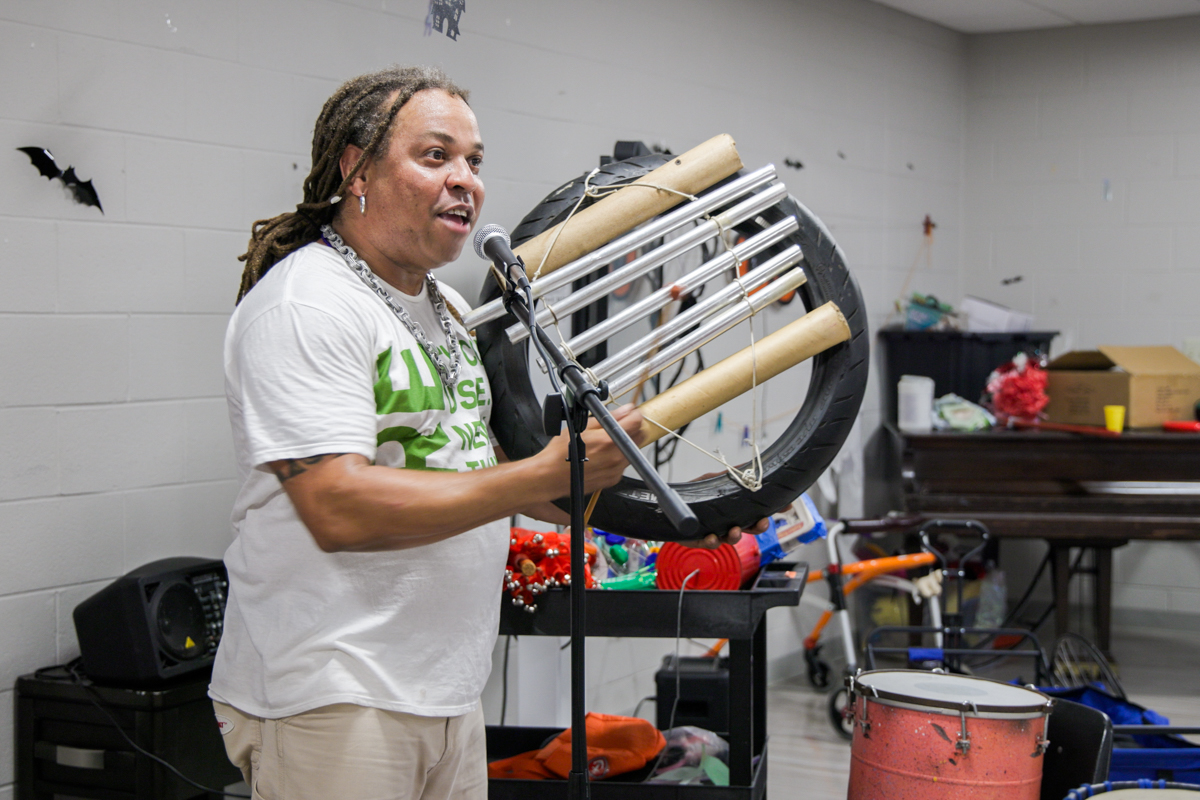 Dendê Macêdo plays a homemade instrument