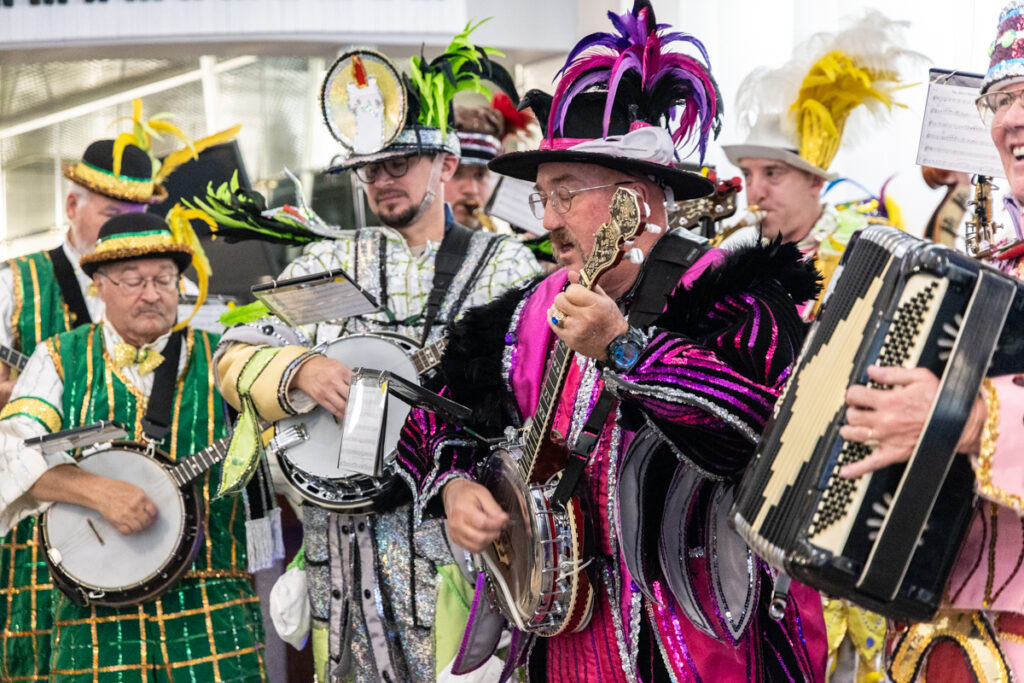 11 20 2025 k paynter 1200x mummers press conference-2 Members of various Mummers clubs’ string bands play their instruments in colorful outfits