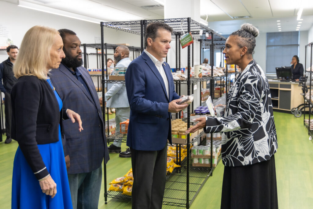 11 3 2025 k paynter 1200x congressional reps at bebashi food bank-6 Brendan Boyle and Mary Gay Scanlon speaking to Sabrina Tate