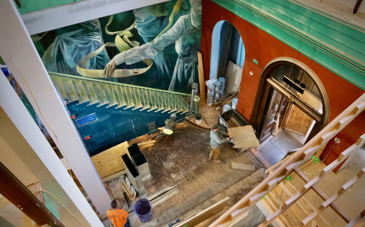 Construction workers and artists transforming Manufacturers National Bank in Old City into the ''Ministry of Awe