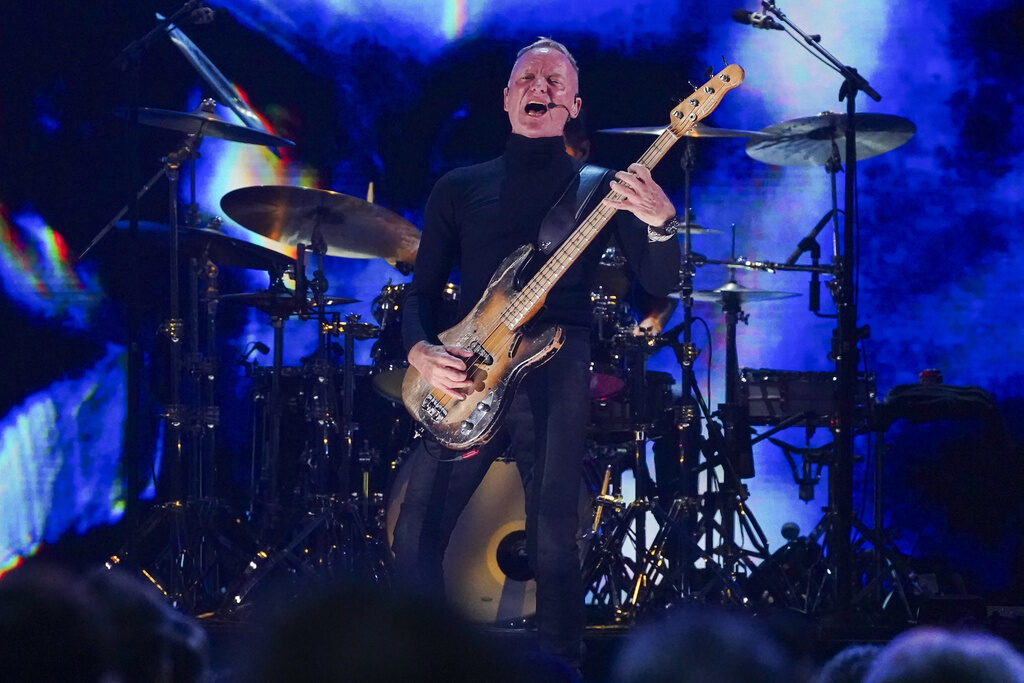 Sting performs during the FireAid benefit concert