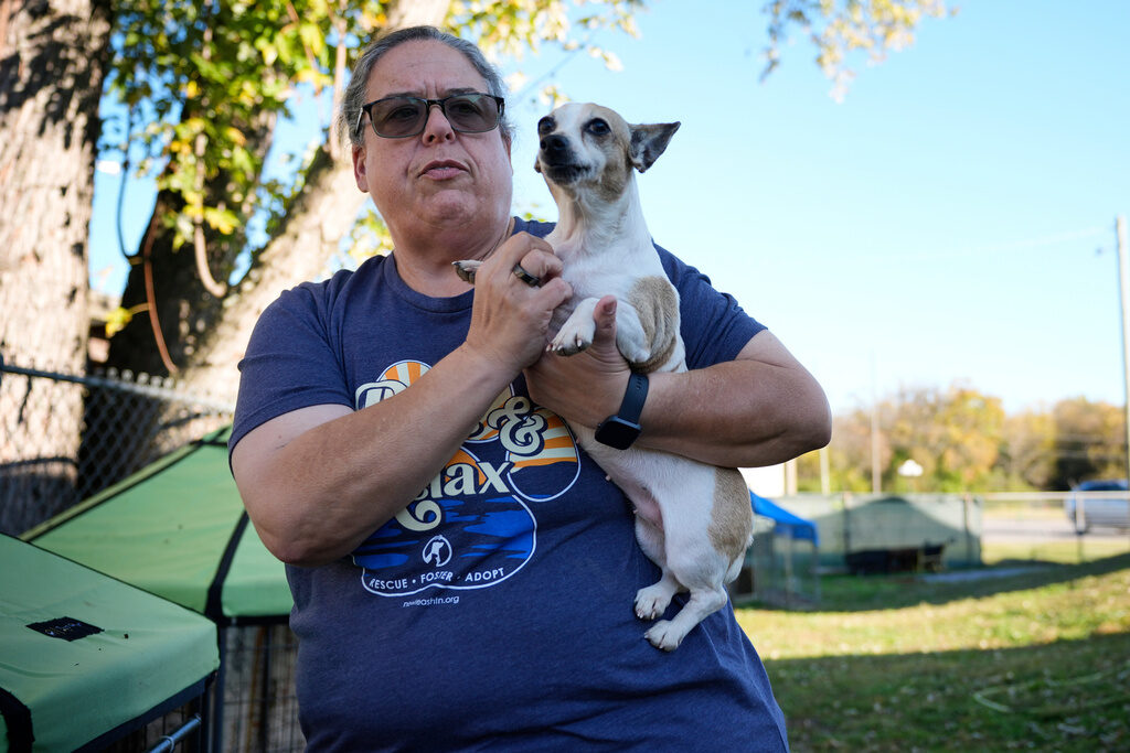 Government Shutdown Food Aid Pets A woman holds a small dog
