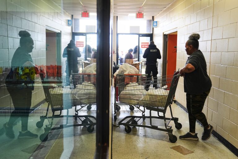 Volunteer Karen Robinson moves groceries durning an emergency food distribution at The Jewish Federation of Greater Philadelphia's Mitzvah Food Program in Philadelphia, Friday, Nov. 7, 2025