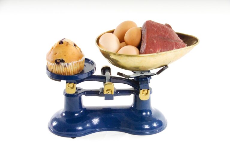 A muffin and protein rich foods on a scale. (Karens4/Bigstock)