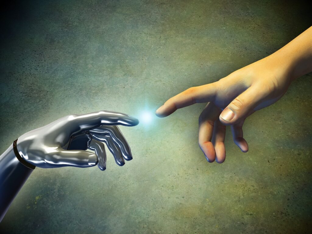 Human hand touching an android hand. (Bigstock)