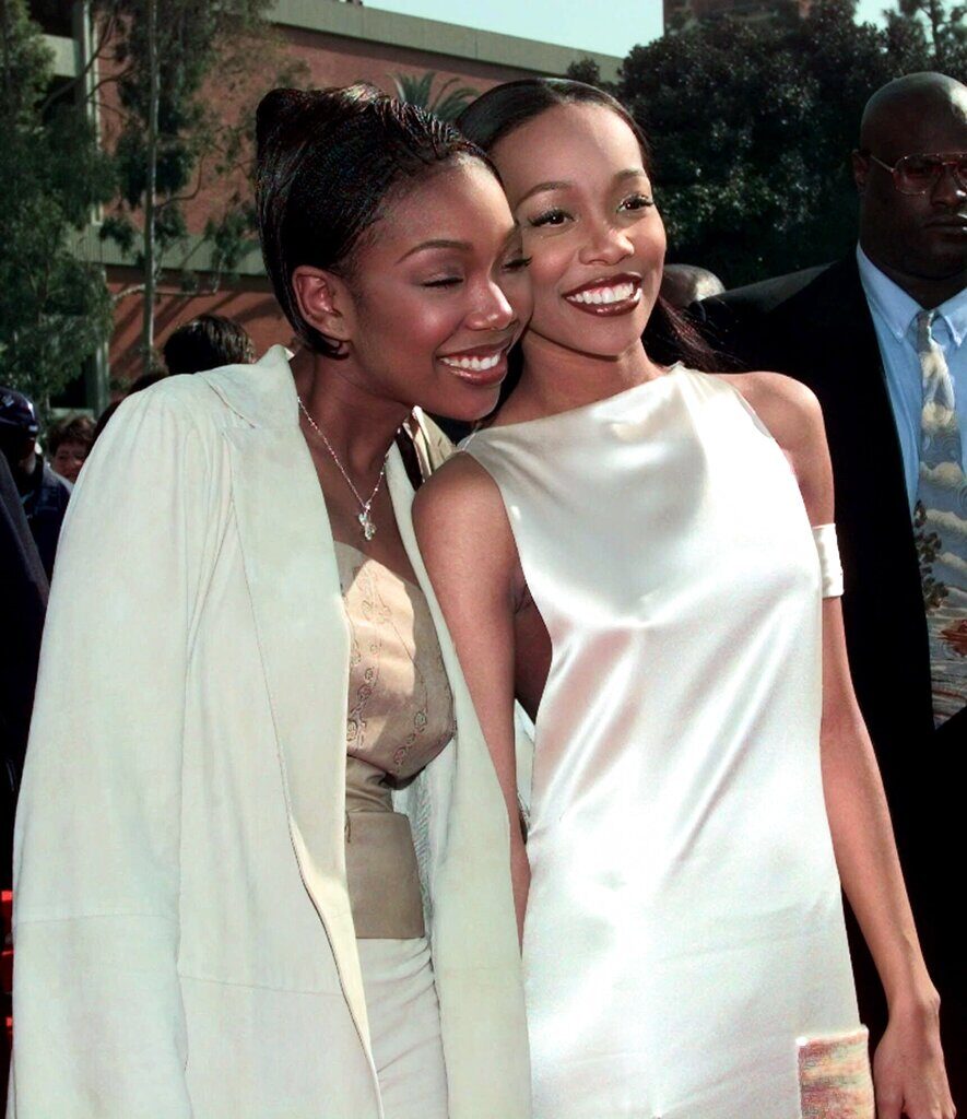 Brandy, left, and Monica arrive at the 41st Annual Grammy Awards at the Shrine Auditorium in Los Angeles Wednesday, Feb. 24, 1999. 