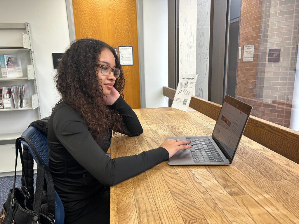 delaware-foster-care-college-payment-program-2025-2 Jenaya Vann at her computer