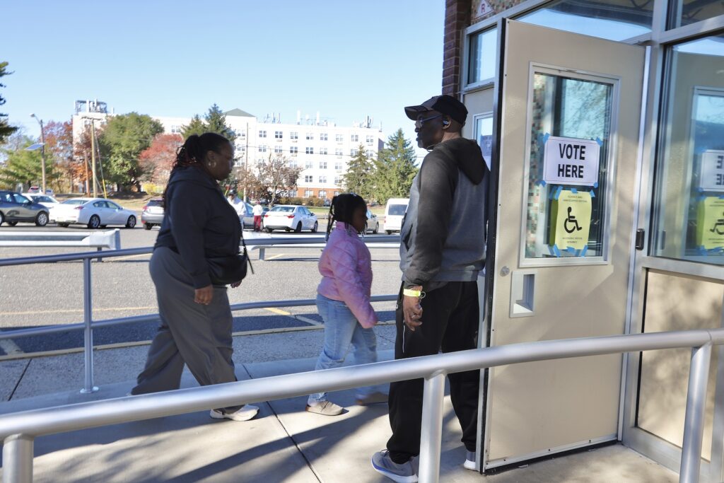 Voters arrive at Stuart Elementary School, a polling place in Willingboro, New Jersey.