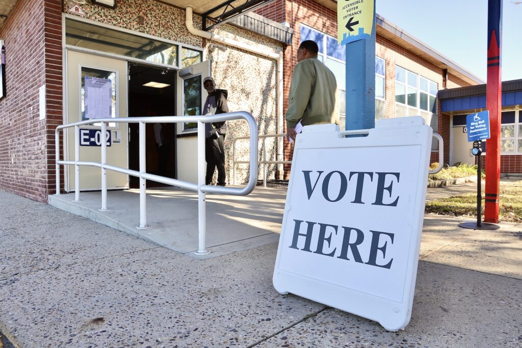 election-day-willingboro-new-jersey-polling-place-voters-EL-03-110425 Voters come and go at Stuart elementary school, a polling place in Willingboro, New Jersey.