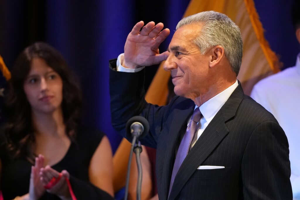 Jack Ciattarelli saluting to the crowd at his election night party