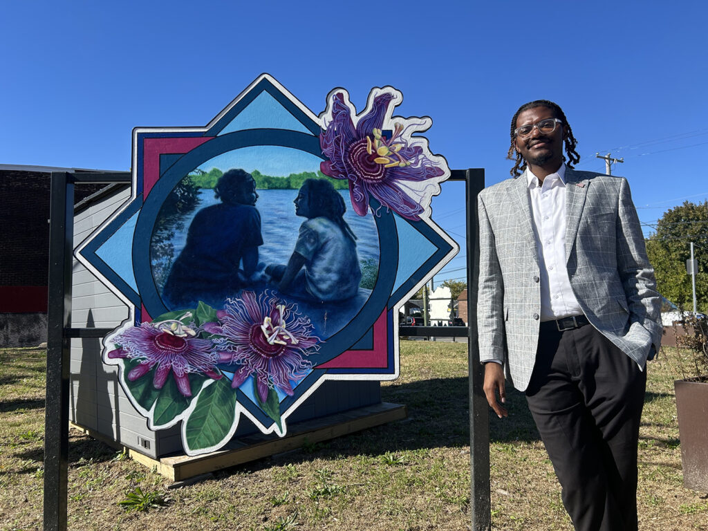 elmwood-avenue-philadelphia-dumpster3 Isaiah T. Martin, Empowered CDC’s president and CEO, stands next to a piece of artwork at the nonprofit's first community waste disposal site near Bartram's Garden.