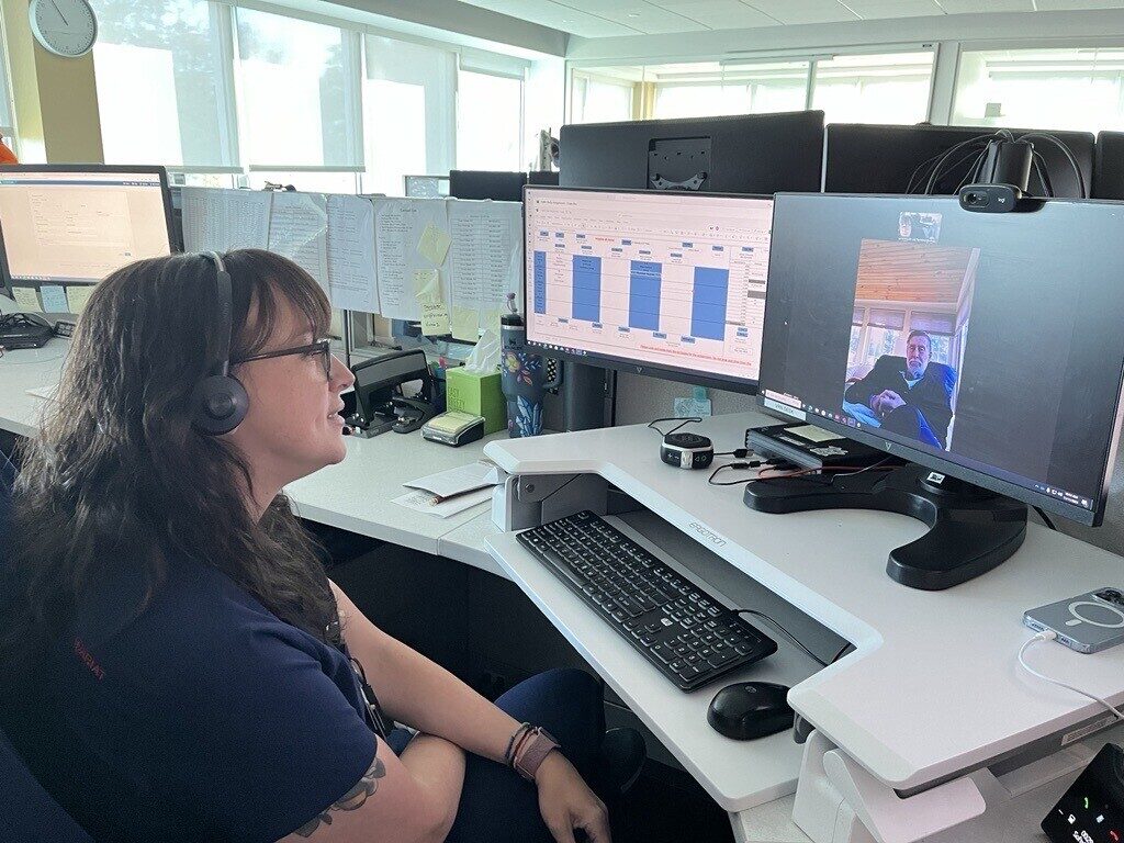 hospital-at-home-virtua-health-2025-2 Virtua registered nurse Rachel Schlichtmann checks in remotely with a patient at a computer