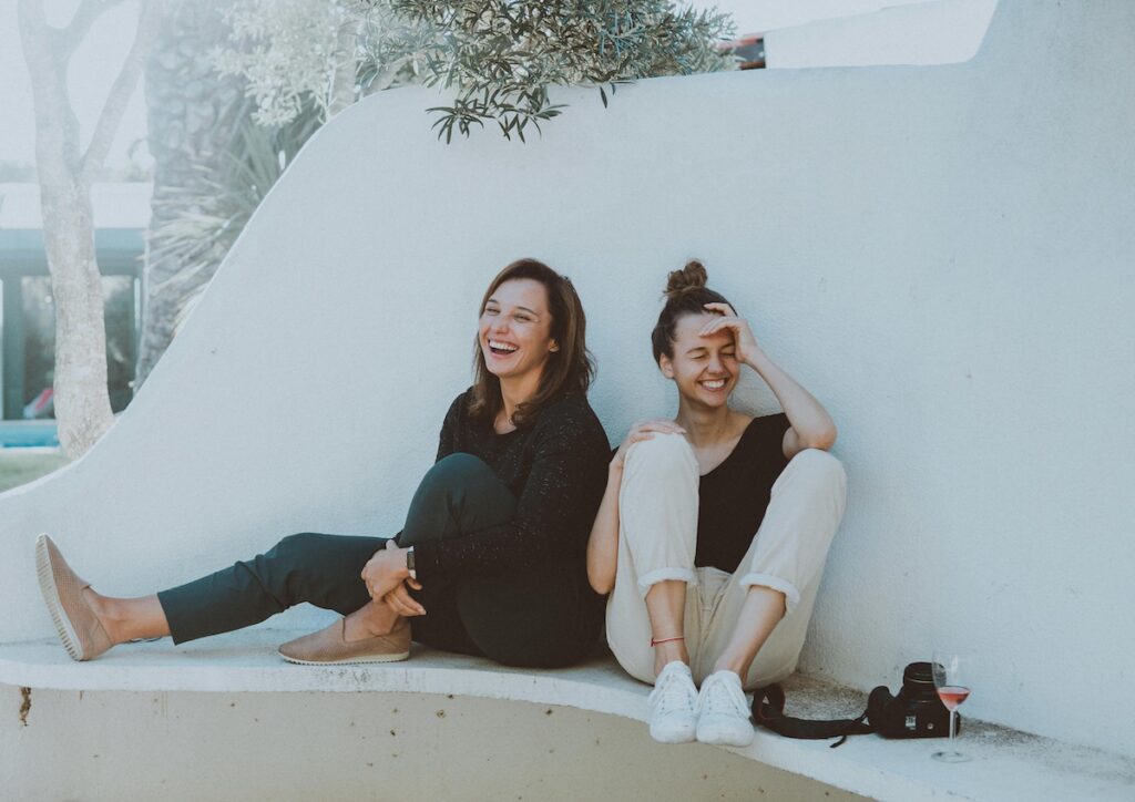 pexels-elletakesphotos-1549280 Two women sitting on a white bench. (Elle Hughes)