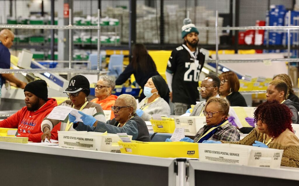 philadelphia-election-day-headquarters-mail-ballots-EL-110425-04 Election workers prepare ballots for scanning at the City of Philadelphia Election Warehouse in North Philadelphia.