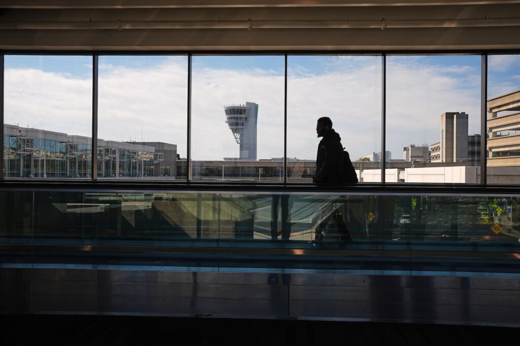Government Shutdown A traveler moves in view of a control tower at Philadelphia International Airport in Philadelphia