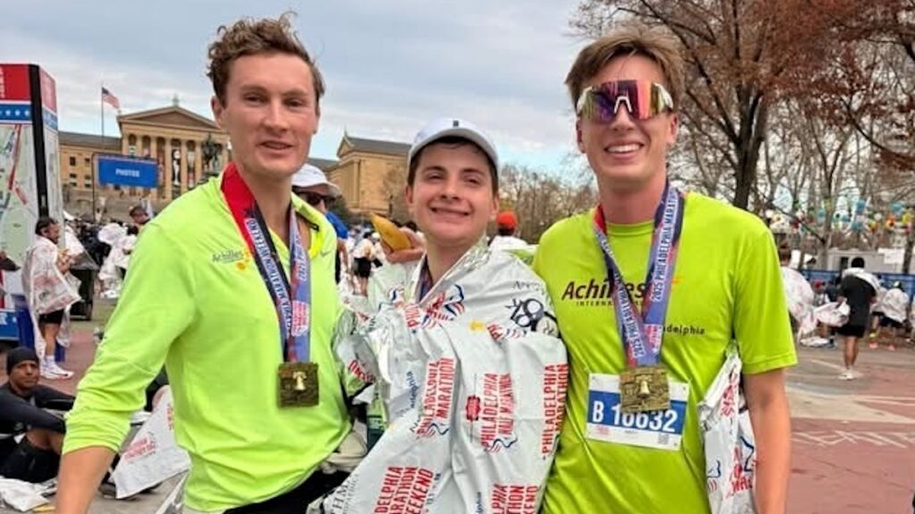 philadelphia-marathon-runners-2025-NK-112725 Sebastian Gomez (center), with Philly Achilles' Chris Aiello (right) and Johnny Fitton, after completing Sunday's 2025 Philadelphia Marathon in less than 3 hours, 30 minutes. (Courtesy of Katie Curran)