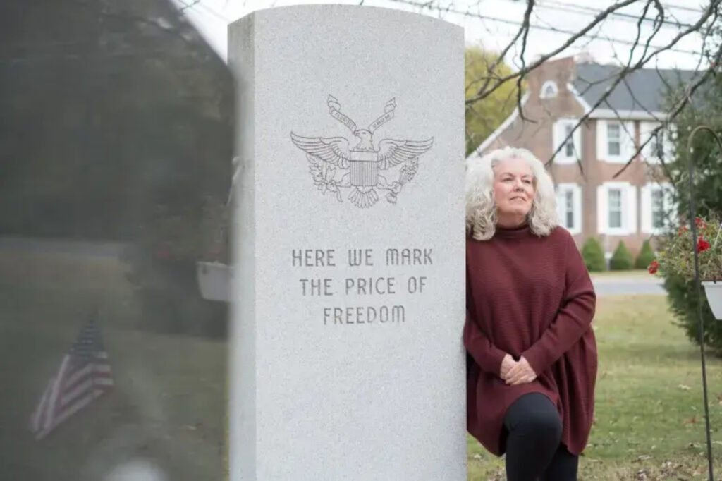 tax-hike-facebook-controversy-south-jersey-2025-1 Gail Nazarene next to a monument reading HERE WE MARK THE PRICE OF FREEDOM