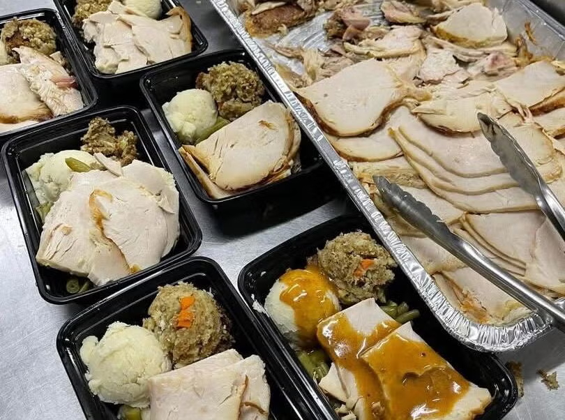 tipsy-cafe-catering-thanksgiving-meals-2024-3-file Thanksgiving plates of turkey with gravy, stuffing, mashed potatoes and green beans