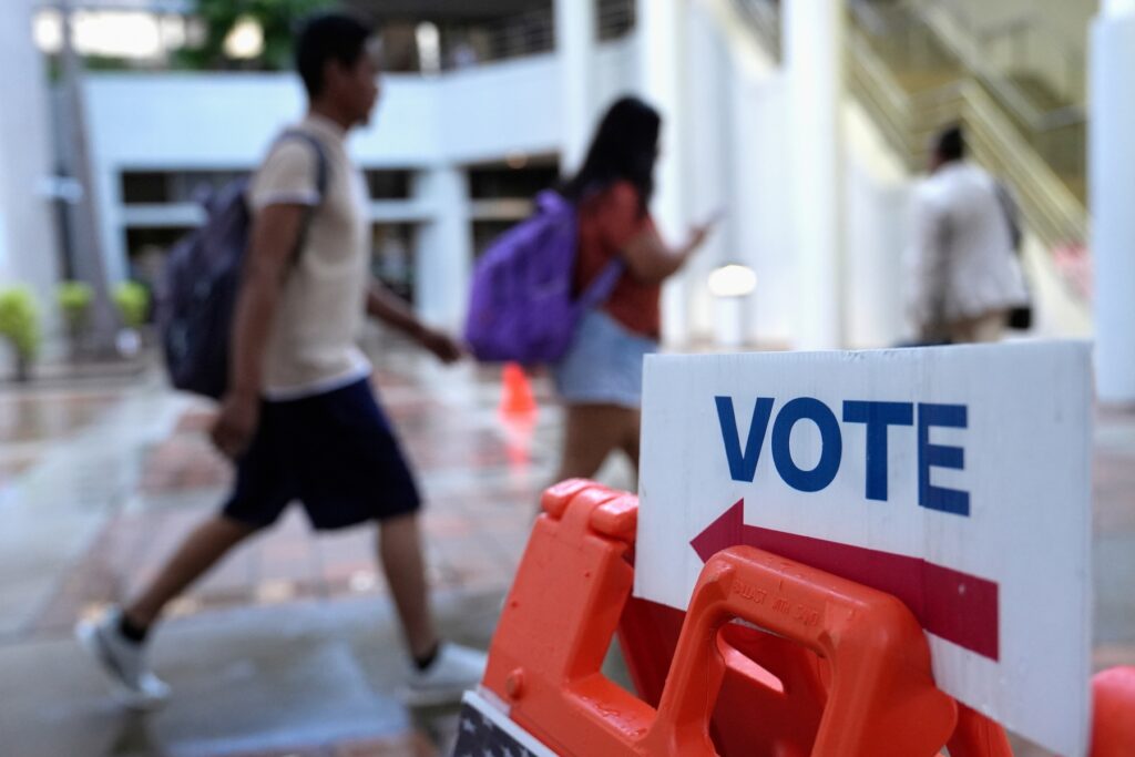 Election 2025 Race Calls People walk past a