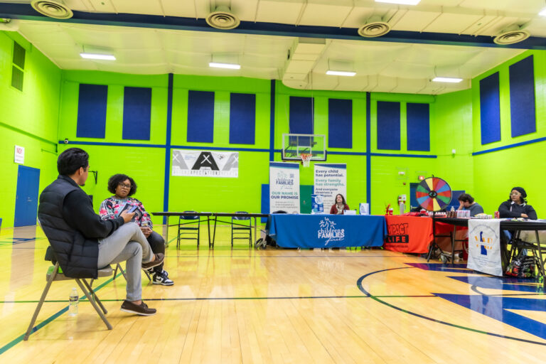 Stacey Chamburger and Johnny Perez-Gonzalez speaking at the resource fair