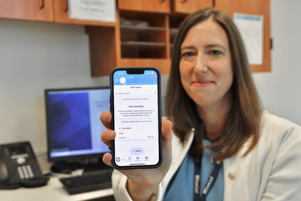 2025 10 29-e lee-corinne rhodes-philadelphia university of pennsylvania-ai in doctors offices app Corinne Rhodes holds up her phone