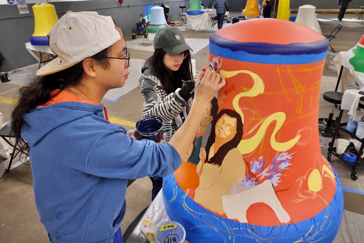 Chenlin Cai and Xingzi Liang work on bell