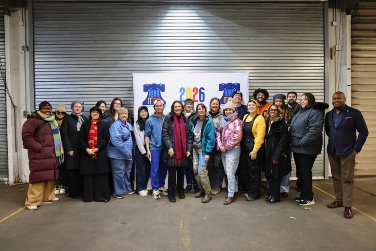 Mural Arts artists and supporters pose for photo