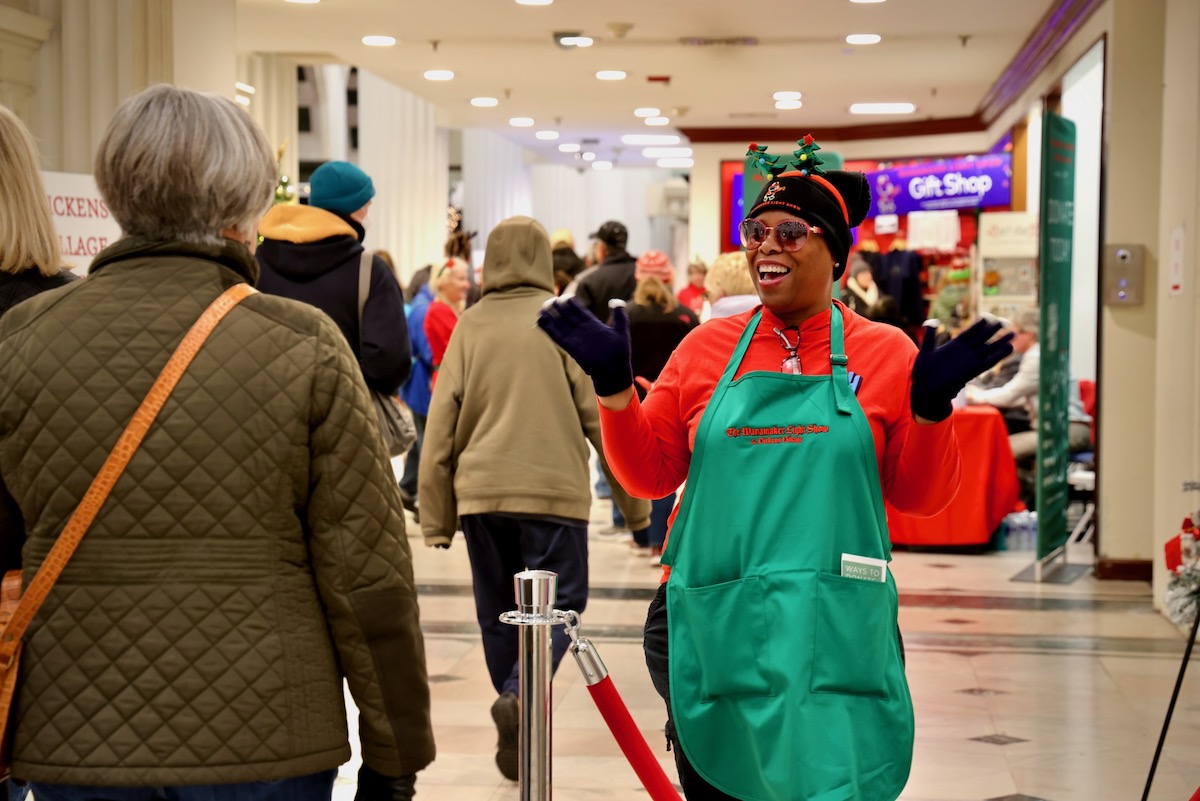 Greeter welcomes visitors to the Wanamaker Building in center city