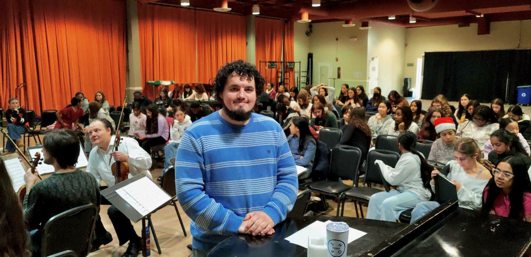 Composer Caleb Etchison stands with the ensemble from the Philadelphia Youth Choral Ensembles
