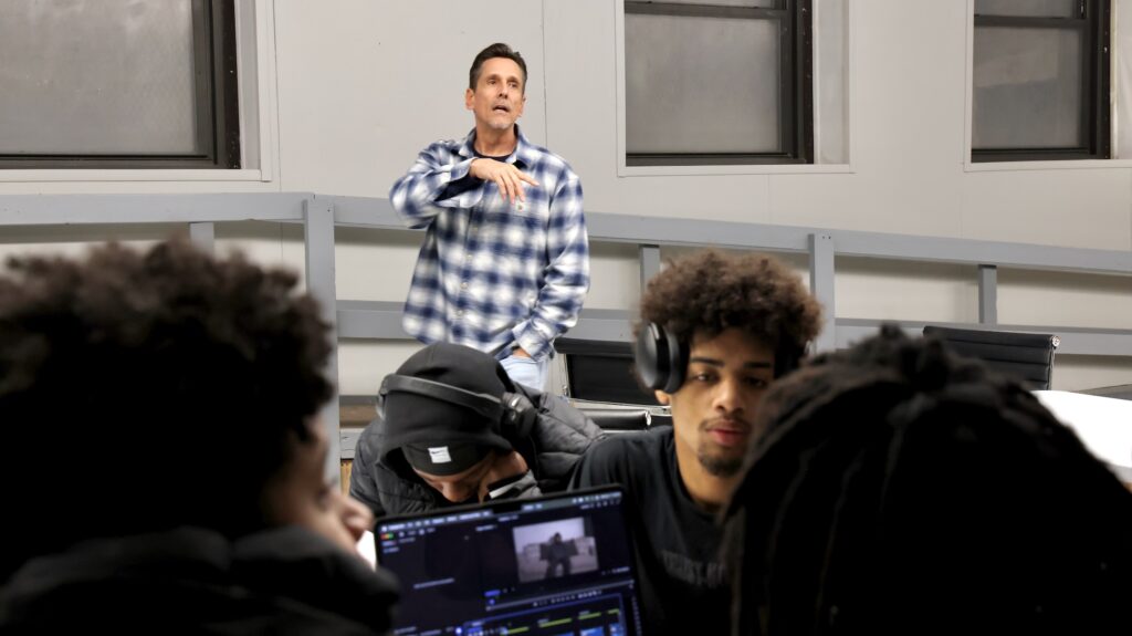 Joseph Halsey standing in front of the class while teaching