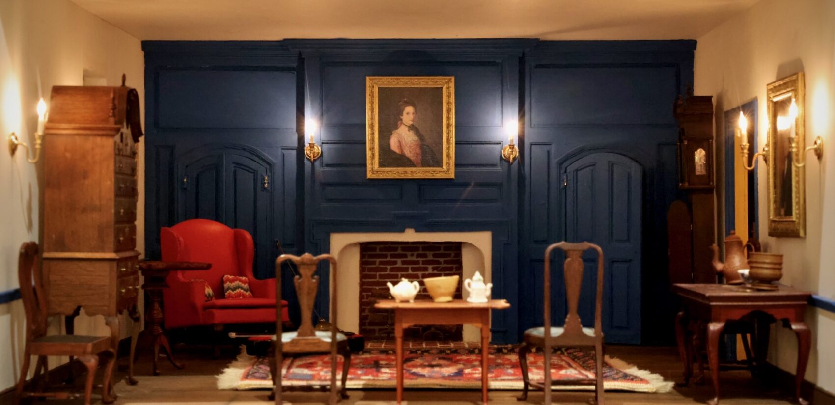 A miniature replica Charles Wilson Peale's portrait of Elizabeth Benezet (1772) hangs in the living room of the Peters-Herdeg dollhouse