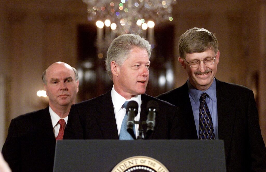 President Clinton, flanked by Celera Genomics head J. Craig Venter, left, and Francis Collins, head of the Human Genome Project of the National Institutes of Health, meets reporters in the East Room of the White House Monday, June 26, 2000 to announce that the two teams have completed a rough draft of the human genetic code. (AP Photo/Rick Bowmer)