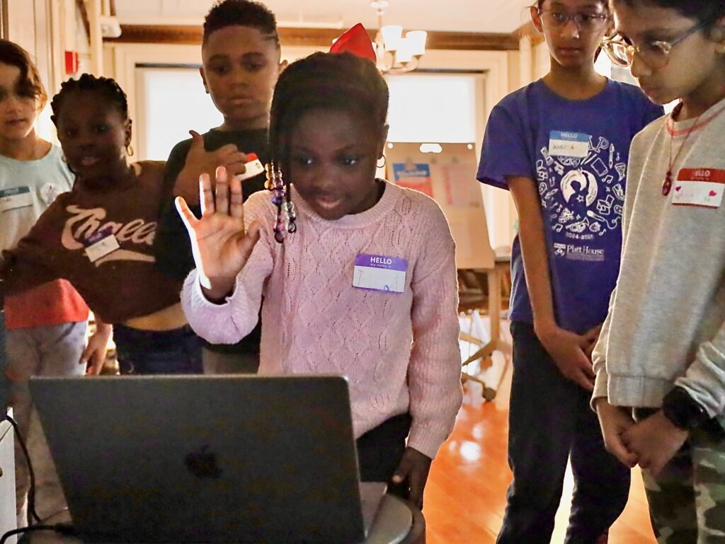 Black-Girls-STEAM-Drexel-Philadelphia-2025-4 a child makes a hand pose in front of a webcam