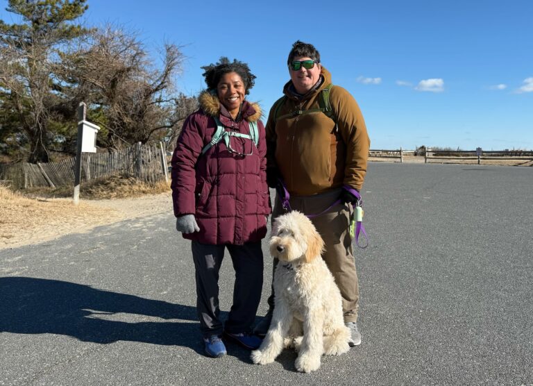 Taylor Lutz, her husband and their dog pose for photo at Cape Henlopen State Park in Delaware on Jan. 1, 2026