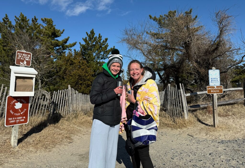 Allison Davenport (right) and her daughter Elizabeth Davenport pose for a photo post-cold plunge at Delaware’s beaches in Cape Henlopen State Park on Jan. 1, 2026.