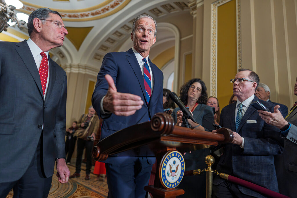Congress Health Care Senate Majority Leader John Thune, R-S.D., joined at left by Sen. John Barrasso, R-Wyo., speaks to reporters after a closed-door meeting with fellow Republicans