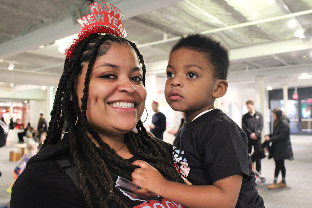 please-touch-museum-new-years-countdown-01 Cherelle Moore (left) holds her 2-year-old son Qadir at the Please Touch Museum in Philadelphia