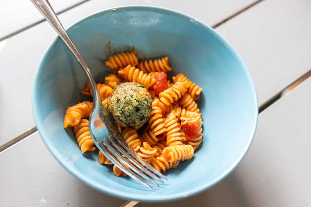Pasta and cheesy kale balls made by students
