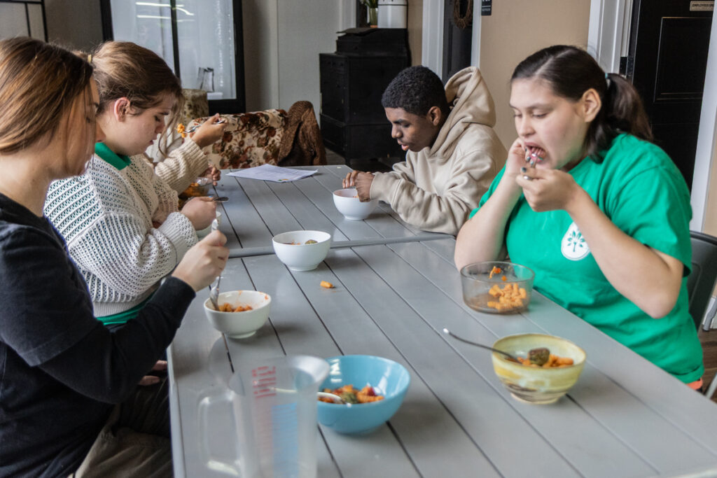 Students with developmental disabilities eat the pasta and cheesy kale balls