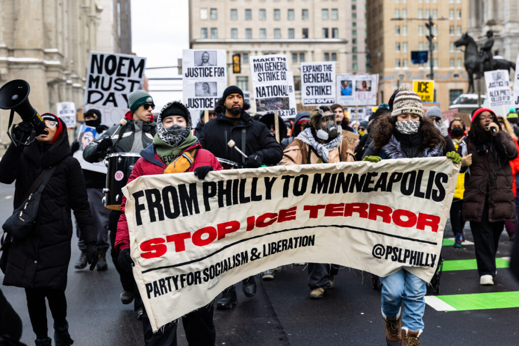 01 26 2026 k paynter psl ice protest-philadelphia-9 Protesters outside City Hall hold a banner reading FROM PHILLY TO MINNEAPOLIS STOP ICE TERROR