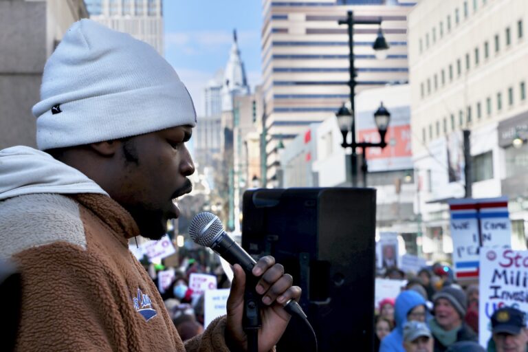 Moses Possible sings ''Lift Every Voice and Sing'' during a Martin Luther King Jr. Day protest against ICE raids.