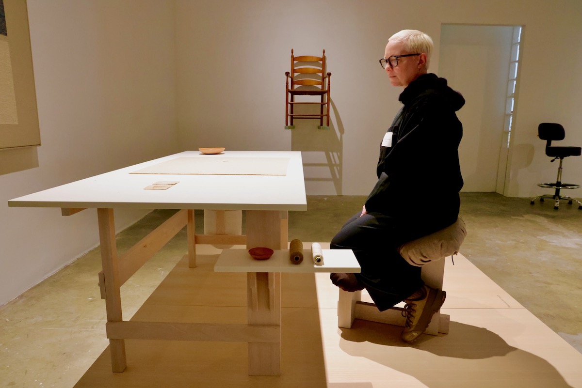 Chris Liljenberg Halstrøm poses with work created for exhibit