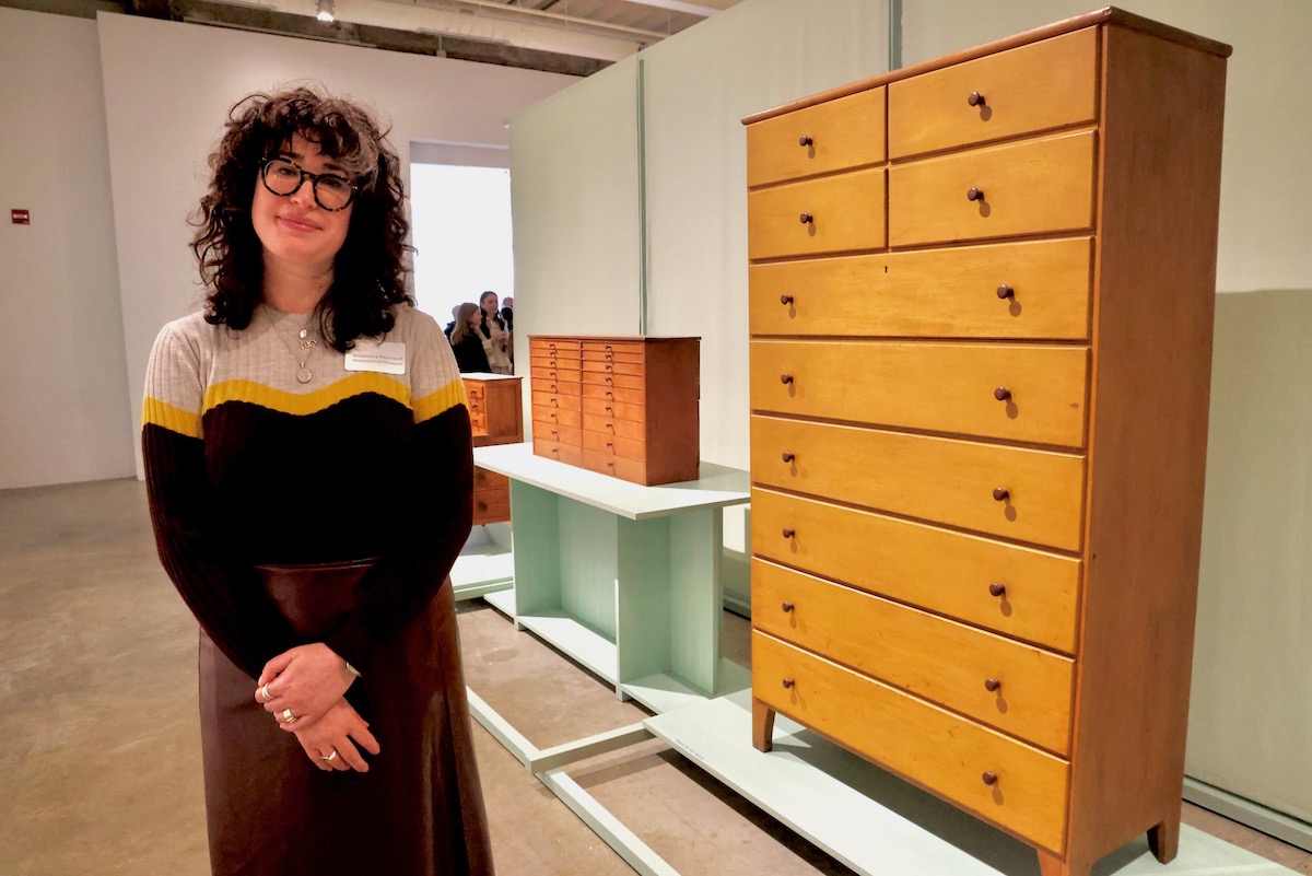 Shoshana Resnikoff posing for photo beside artwork