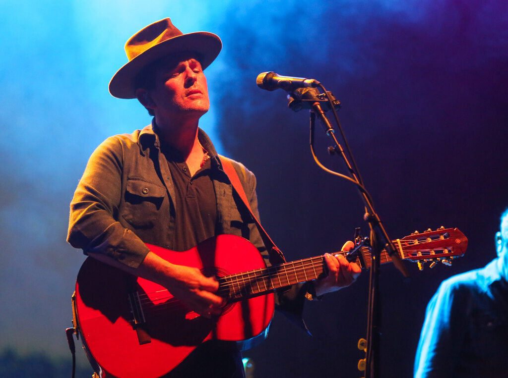Gregory Alan Isakov performs acoustic guitar on stage
