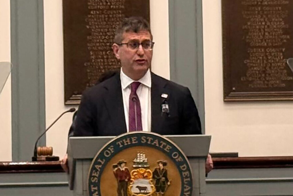del-sots-jpg-meyer-7 Matt Meyer standing at a podium giving a speech in Legislative Hall
