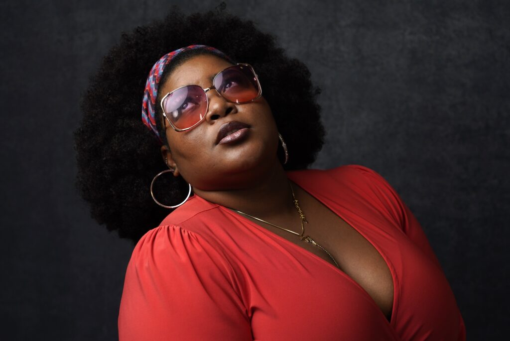 Dulce Sloan looking up as she poses during a promotional photo shoot